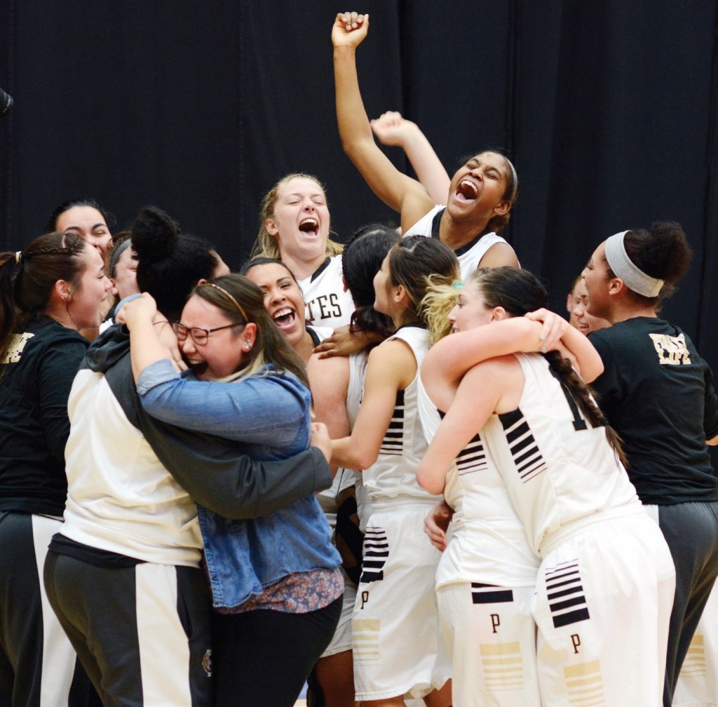Pirate women reveling in triumphant victory after routing Lane in the title game. Photo by Rick Ross