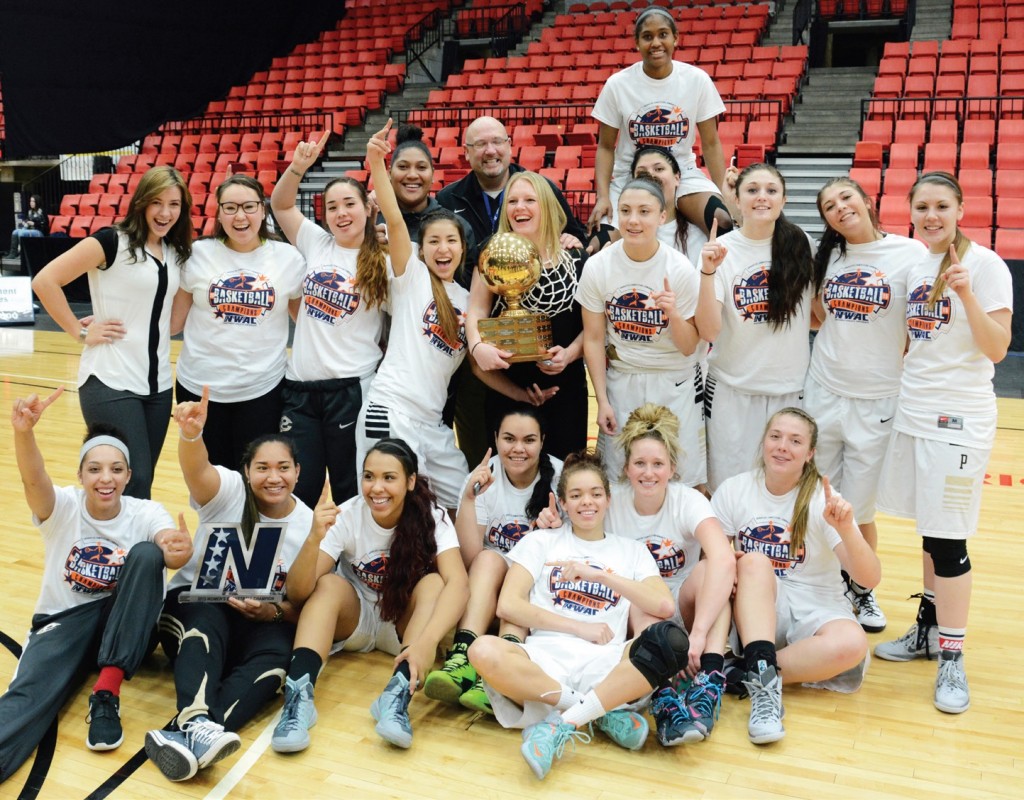 Peninsula women showing off their first place trophy after a remarkable win. Photo by Rick Ross