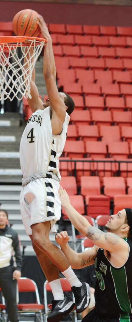 Deonte Dixon throws down a dunk. Photo by Rick Ross