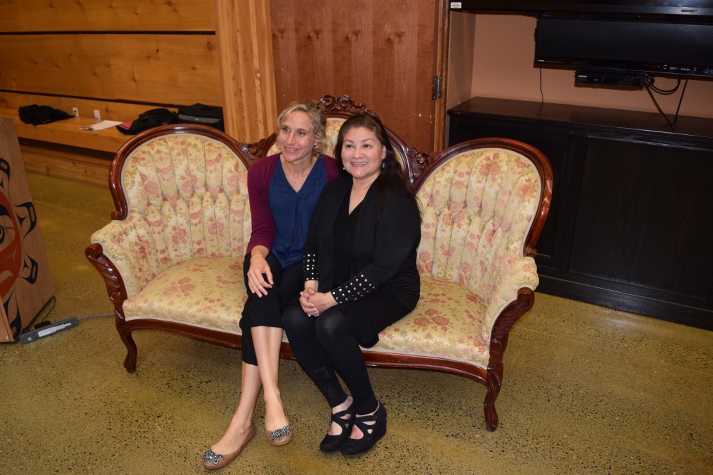 Helen Lovejoy and Sonya Rosario sitting on Sonya's healing Victorian sofa.