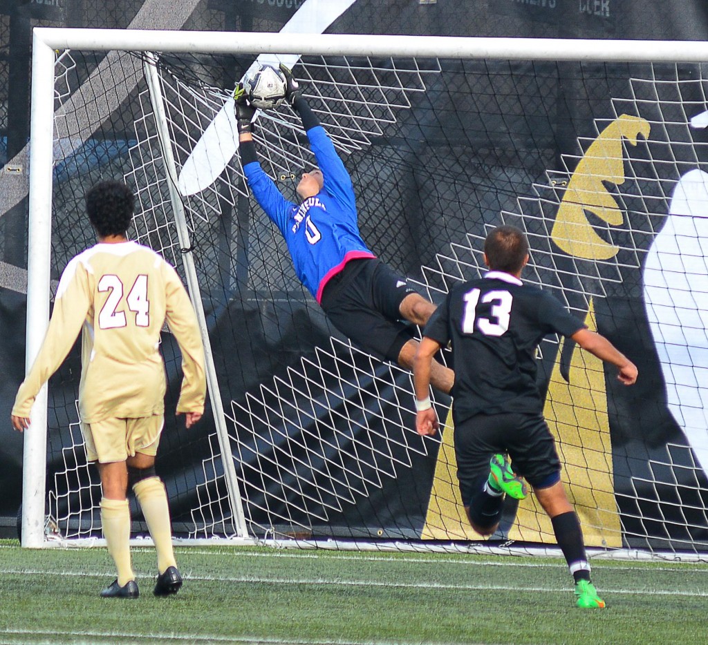 Keeper Nick Johnson making a diving save. - Photo by Jay R. Cline
