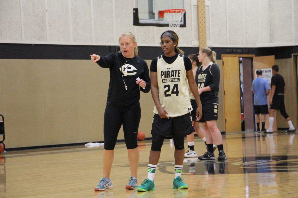 Head coach Ali Crumb and point guard Imani Smith. - Photo by Eric Trent
