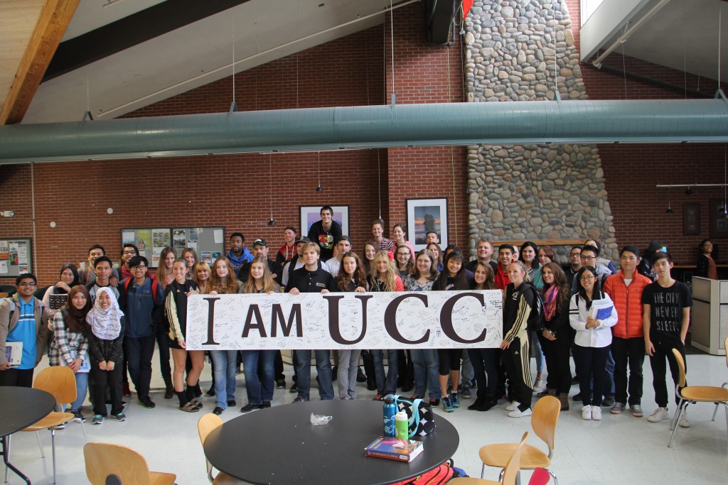 Peninsula College student showing support for Umpqua Community College, holding a banner they signed that will be sent to Umpqua. - Photo by Giovanni Roverso