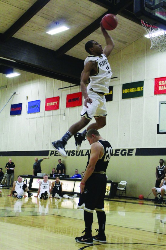 Deonte Dixon unleashes his winning dunk. - Photo by Judah Breitbach