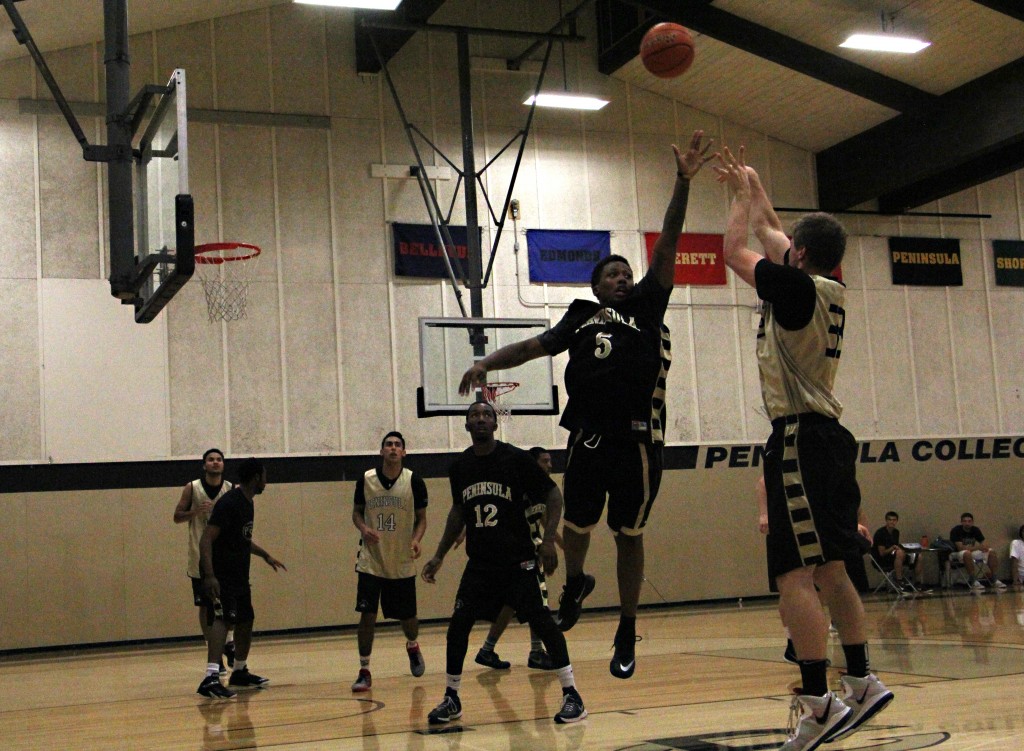 Freshman guard Darrion Daniels, attempting to block sophomore forward Zach Nibler. - Photo by Eric Trent