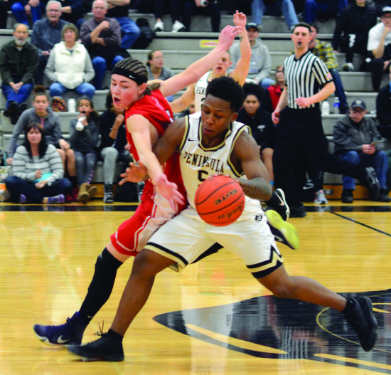 Darrion Daniels fends off Everett’s Brevin Brown during the second half. - Photo by Rick Ross