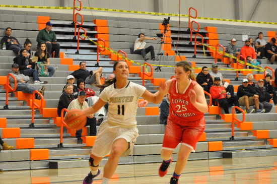 Cierra Moss drives in for a layup against Lower Columbia. - Photo by Mike Drake