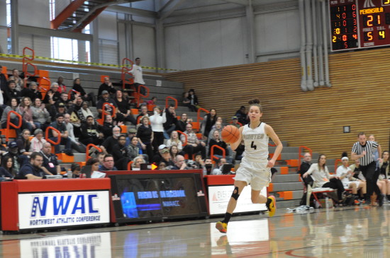 Zhara Laster brings the ball up-court. - Photo by Mike Drake