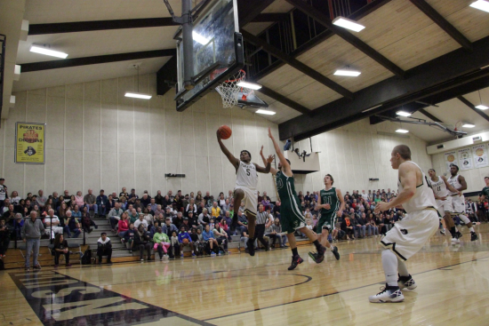 Darrion Daniels soars for a layup against Chemeketa. Daniels led all scorers with 19 points.