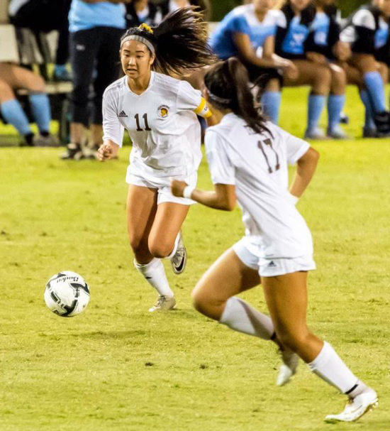 Janya Morikawa, left, advances the ball.