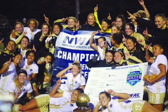 The Lady Pirates pose with the NWAC trophy and banner after winnin the championship game at Starefire Sports Complex in Takwila on Nov. 11, 2016. - Photo by Mike Drake